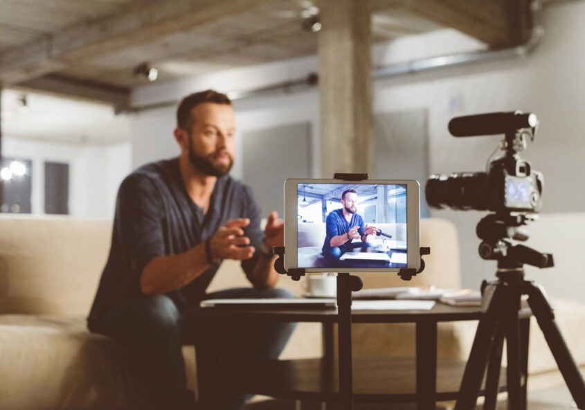 Young man making a video blog